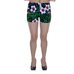 Pink Flowers Over A Green Grass Skinny Shorts by DanaeStudio