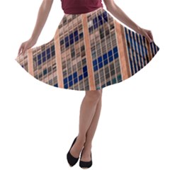 Low Angle Photography Of Beige And Blue Building A-line Skater Skirt by Pakrebo