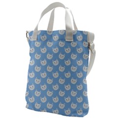 Cute Cat Faces White And Blue  Canvas Messenger Bag by SpinnyChairDesigns