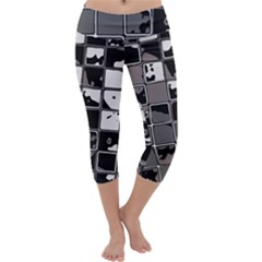 Black And White Checkered Grunge Pattern Capri Yoga Leggings by SpinnyChairDesigns