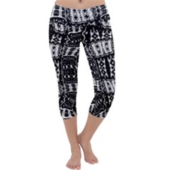 Abstract Black And White Stripes Checkered Pattern Capri Yoga Leggings by SpinnyChairDesigns