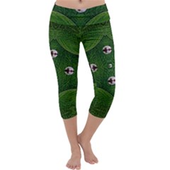 One Island In A Safe Environment Of Eternity Green Capri Yoga Leggings by pepitasart