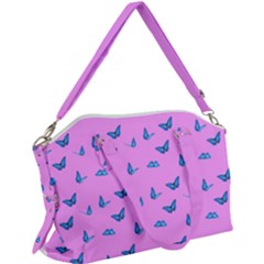 Blue Butterflies At Pastel Pink Color Background Canvas Crossbody Bag by Casemiro