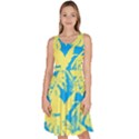 Yellow and blue leafs silhouette at sky blue Knee Length Skater Dress With Pockets View1