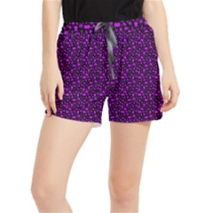 Small Bright Dayglo Purple Halloween Motifs Skulls, Spells & Cats On Spooky Black Women s Runner Shorts by PodArtist