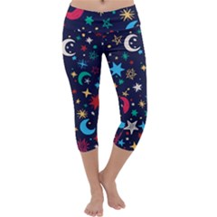 Colorful-background-moons-stars Capri Yoga Leggings by Wegoenart