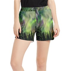 Aurora Borealis In Sky Over Forest Women s Runner Shorts by danenraven