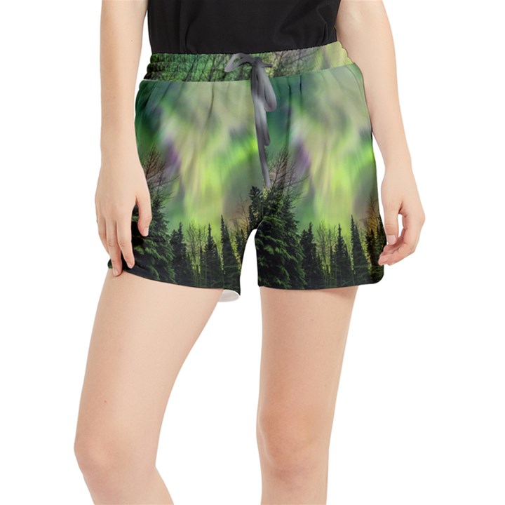 Aurora Borealis In Sky Over Forest Women s Runner Shorts