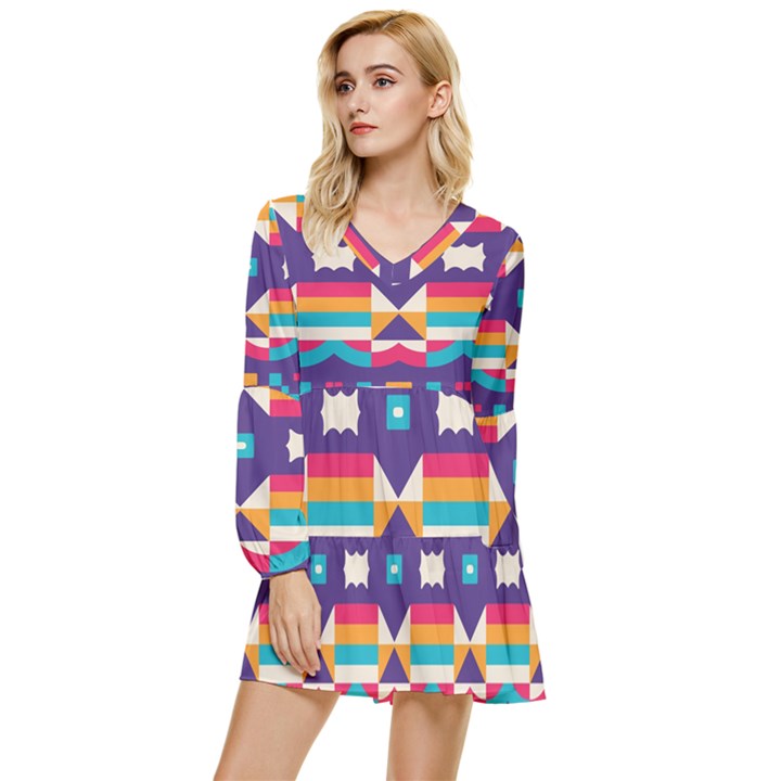 Pastel shapes rows on a purple background                                                 Tiered Long Sleeve Mini Dress