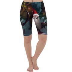 A Santa Claus Standing In Front Of A Dragon Cropped Leggings  by bobilostore