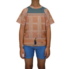 Person Stands By Tall Orange Wall And Looks- Up Kids  Short Sleeve Swimwear by artworkshop