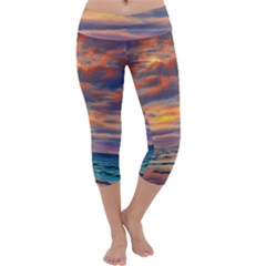 Serene Sunset Over Beach Capri Yoga Leggings by GardenOfOphir