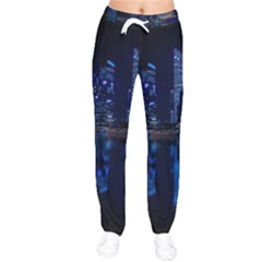 Illuminated Cityscape Against Blue Sky At Night Women Velvet Drawstring Pants by Modalart