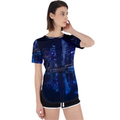 Illuminated Cityscape Against Blue Sky At Night Perpetual Short Sleeve T-shirt by Modalart