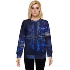 Illuminated Cityscape Against Blue Sky At Night Hidden Pocket Sweatshirt by Modalart