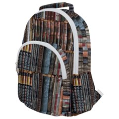 Assorted Title Of Books Piled In The Shelves Assorted Book Lot Inside The Wooden Shelf Rounded Multi Pocket Backpack by Bedest