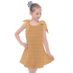 An Orange And Yellow Background With A Pattern Kids  Tie Up Tunic Dress