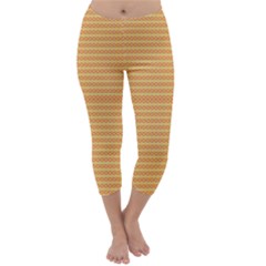 An Orange And Yellow Background With Small Dots Capri Winter Leggings 