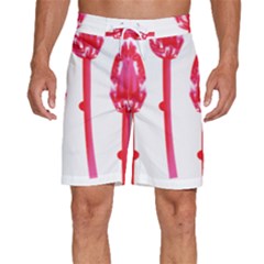 Three Pink Flowers With A Black Background Men s Beach Shorts