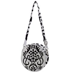 A Black And White Image Of An Ornate Design Crossbody Circle Bag