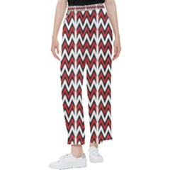 A Red And Black Zigzag Pattern On A White Background Women s Pants 