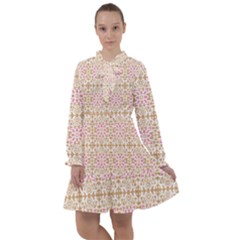 A Pink And White Flower Pattern On A Brown Background All Frills Dress