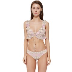 A Pink And White Flower Pattern On A Brown Background Low Cut Ruffle Edge Bikini Set