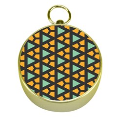 Green triangles and other shapes pattern 			Gold Compass