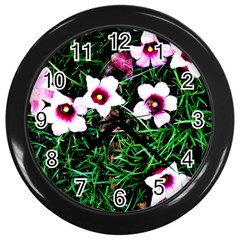 Pink Flowers Over A Green Grass Wall Clocks (black) by DanaeStudio