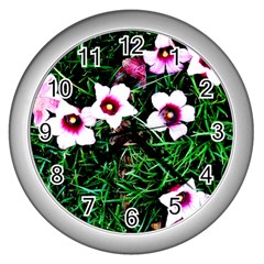 Pink Flowers Over A Green Grass Wall Clocks (silver)  by DanaeStudio