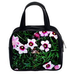 Pink Flowers Over A Green Grass Classic Handbags (2 Sides) by DanaeStudio