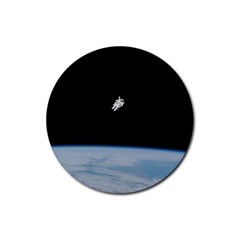 Astronaut Floating Above The Blue Planet Rubber Round Coaster (4 Pack)  by Nexatart