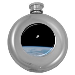 Astronaut Floating Above The Blue Planet Round Hip Flask (5 Oz) by Nexatart