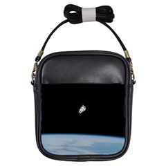 Astronaut Floating Above The Blue Planet Girls Sling Bags by Nexatart