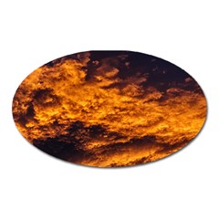 Abstract Orange Black Sunset Clouds Oval Magnet by Simbadda