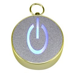 Close Up Of A Power Button Gold Compasses