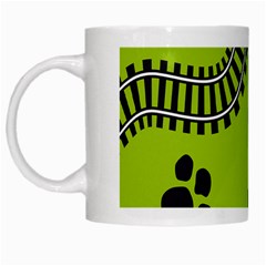 Green Prints Next To Track White Mugs by Nexatart