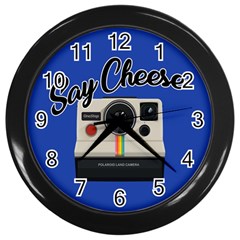 Say Cheese Wall Clocks (black) by Valentinaart