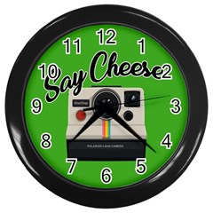 Say Cheese Wall Clocks (black) by Valentinaart