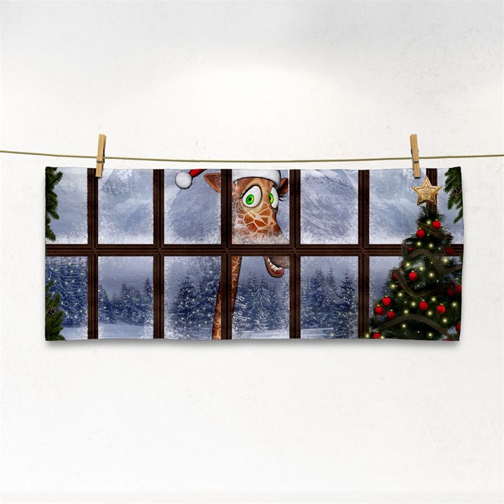 Funny Giraffe  With Christmas Hat Looks Through The Window Hand Towel