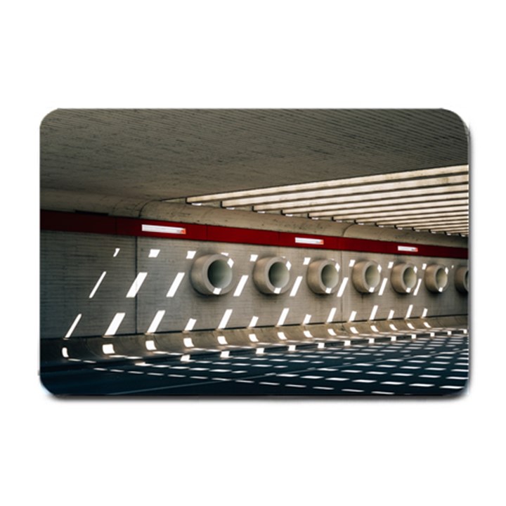 Patterned tunnels on the concrete wall Small Doormat