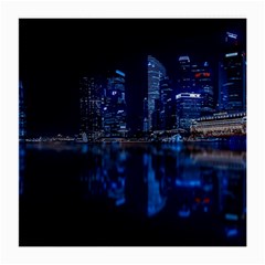 Illuminated Cityscape Against Blue Sky At Night Medium Glasses Cloth by Modalart