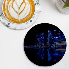 Illuminated Cityscape Against Blue Sky At Night Uv Print Round Tile Coaster by Modalart