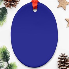 A Blue Wall With A Clock On It Ornament (oval)