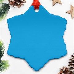 A Blue Background With A Black And White Cat On Top Of It Ornament (snowflake)