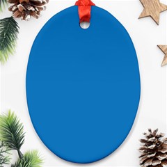 A Blue Background With A Black And White Clock Ornament (oval)