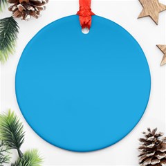 A Blue Background With A Black And White Cat On Top Of It Ornament (round) by catchydesignhill