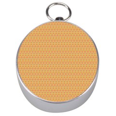 An Orange And Yellow Background With A Pattern Silver Compasses