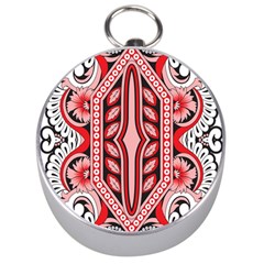 A Design Of A Red And White Pattern Silver Compasses