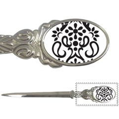 A Black And White Image Of An Ornate Design Letter Opener